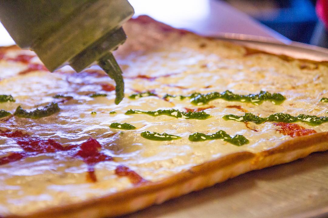 Gourmet pizza with sauce drizzle